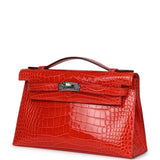 Hermès Kelly Pochette Alligator Mississippien Brillant Orange Poppy Finition Palladium